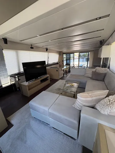  Yacht Photos Pics Luxurious interior of a 2018 Prestige 680 yacht with modern furnishings and large windows.