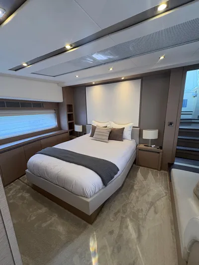  Yacht Photos Pics Luxurious bedroom interior of 2018 Prestige 680 yacht with modern design and cozy ambiance.
