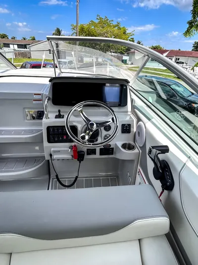  Yacht Photos Pics 2023 Regal 26 XO boat cockpit with modern steering and navigation system.