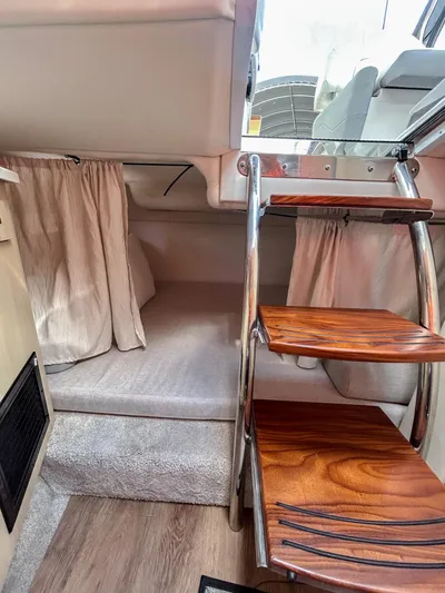  Yacht Photos Pics Interior of 2023 Regal 26 XO boat with wooden steps and cozy cabin space.