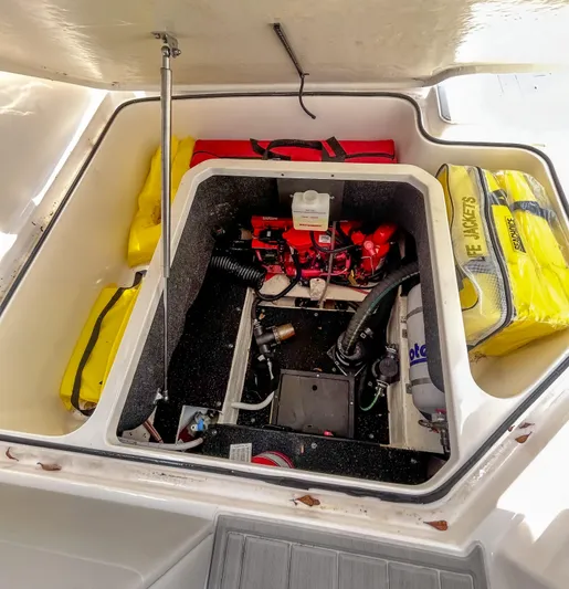  Yacht Photos Pics 2023 Regal 26 XO boat engine compartment with safety equipment and storage.
