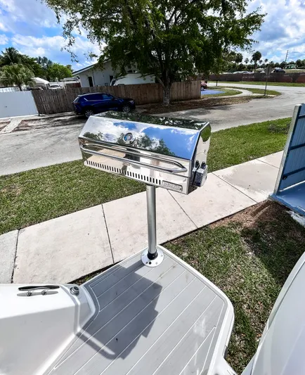  Yacht Photos Pics 2023 Regal 26 XO boat with a mounted stainless steel grill on deck.