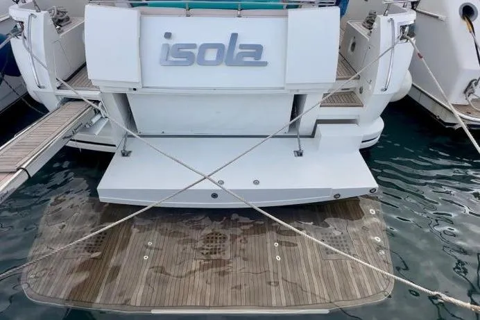  Yacht Photos Pics Stern view of 2008 Sanlorenzo 62 yacht "Isola" with wooden swim platform.