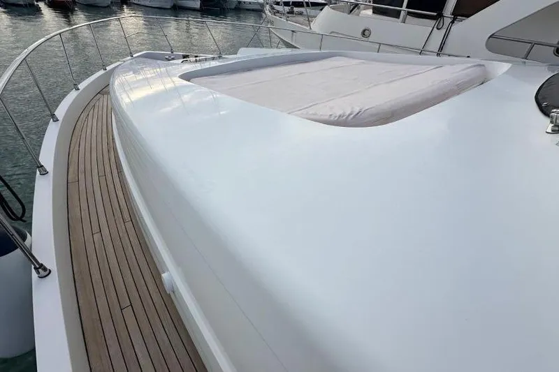  Yacht Photos Pics Sanlorenzo 62 yacht deck, 2008 model, featuring sleek white surface and wooden accents.