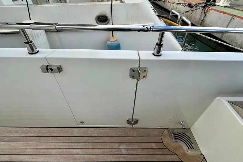  Yacht Photos Pics Sanlorenzo 62 yacht deck detail, 2008 model, featuring stainless steel railing and wooden flooring.