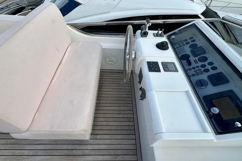  Yacht Photos Pics Helm station of 2008 Sanlorenzo 62 yacht with steering wheel and control panel.