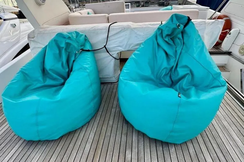  Yacht Photos Pics Turquoise bean bags on the deck of a 2008 Sanlorenzo 62 yacht.