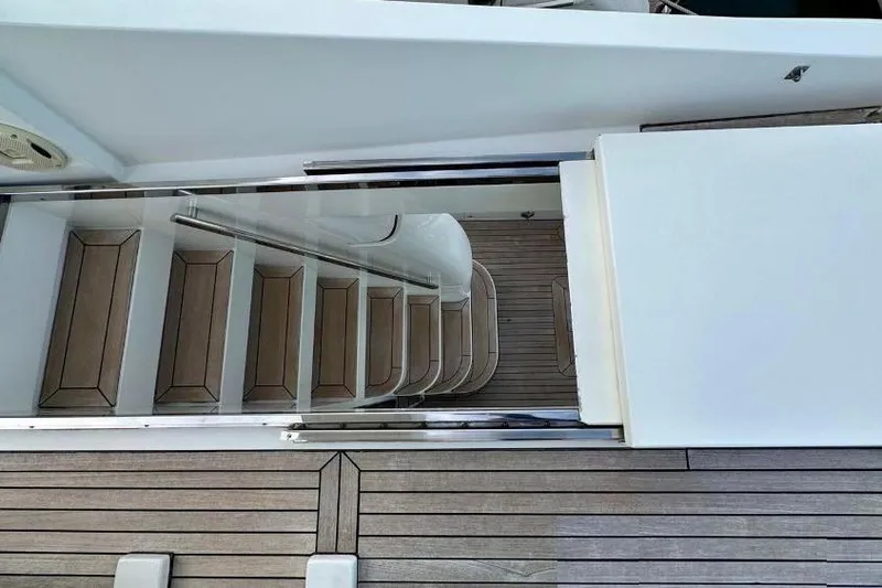  Yacht Photos Pics Staircase on 2008 Sanlorenzo 62 yacht with sleek wooden design and modern railing.