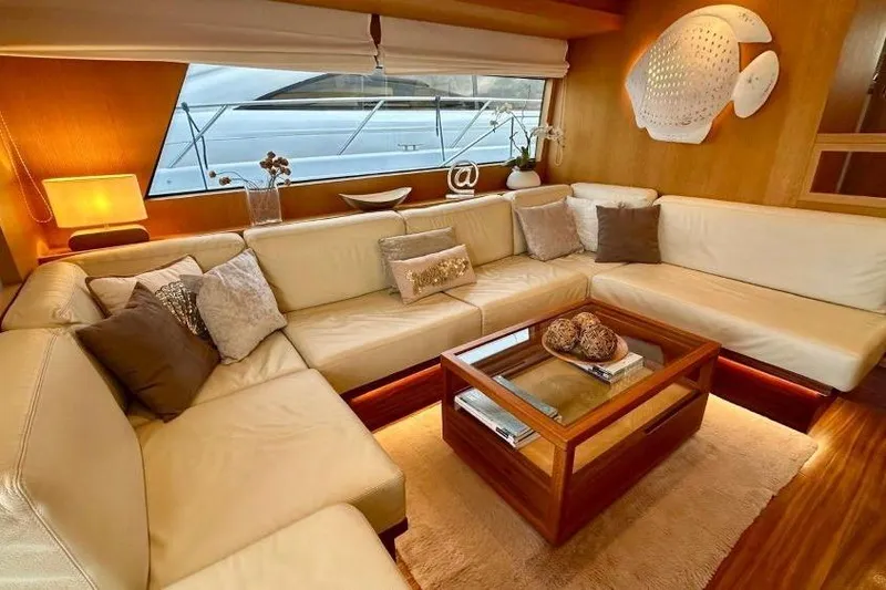  Yacht Photos Pics Luxurious 2008 Sanlorenzo 62 yacht interior with elegant beige seating and wooden accents.