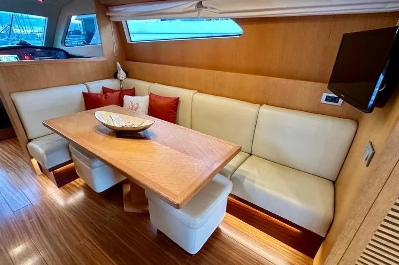  Yacht Photos Pics Luxurious interior of 2008 Sanlorenzo 62 yacht with elegant dining area and modern decor.
