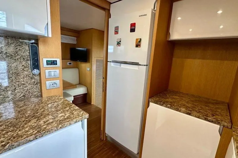  Yacht Photos Pics Interior of 2008 Sanlorenzo 62 yacht kitchen with granite countertops and modern appliances.