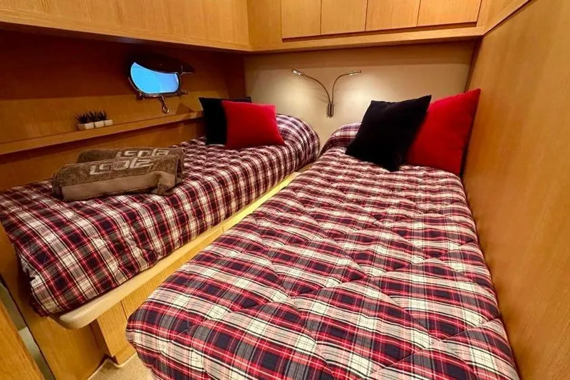  Yacht Photos Pics Twin beds with plaid bedding in 2008 Sanlorenzo 62 yacht cabin.