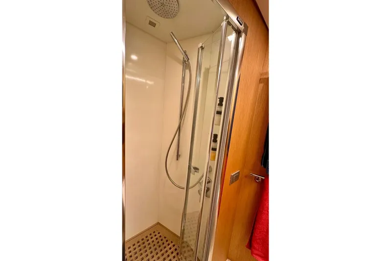  Yacht Photos Pics Shower cabin in 2008 Sanlorenzo 62 yacht, featuring modern fixtures and glass door.