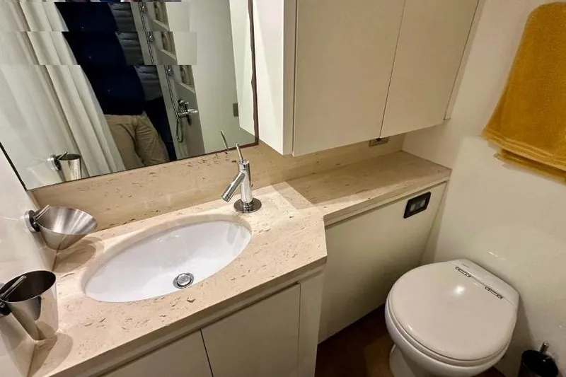  Yacht Photos Pics Luxurious bathroom in 2008 Sanlorenzo 62 yacht with modern fixtures and elegant design.