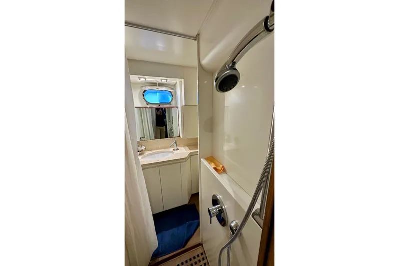 Yacht Photos Pics Bathroom interior of 2008 Sanlorenzo 62 yacht, featuring shower and sink.