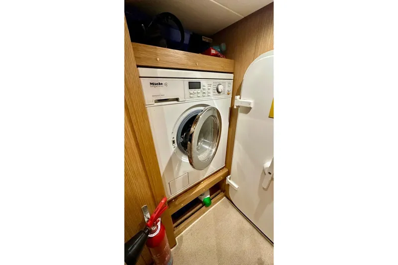  Yacht Photos Pics Laundry area with Miele washer on 2008 Sanlorenzo 62 yacht.