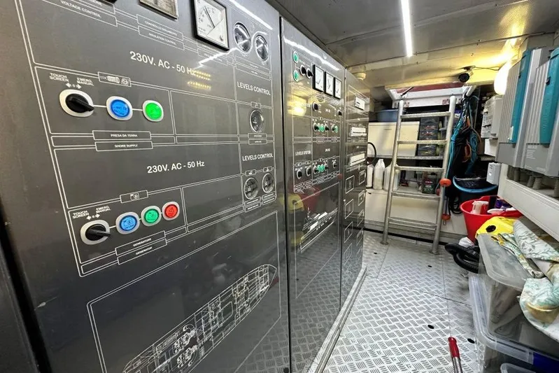  Yacht Photos Pics Electrical control room of a 2008 Sanlorenzo 62 yacht, featuring panels and equipment.