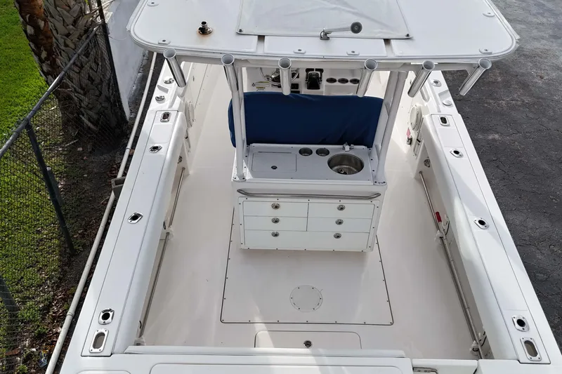  Yacht Photos Pics 2015 Edgewater 320CC boat interior, featuring spacious deck and center console.