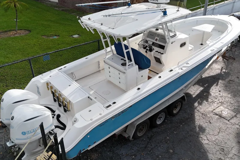  Yacht Photos Pics 2015 Edgewater 320CC boat with dual Yamaha engines on a trailer.