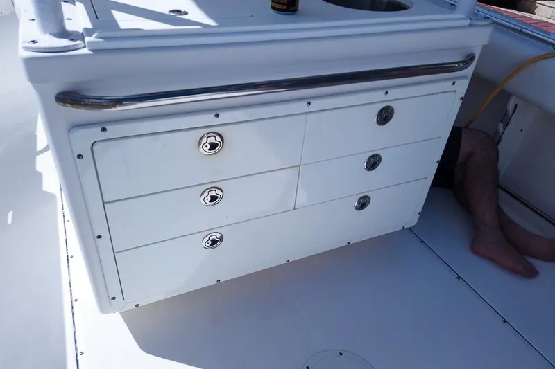  Yacht Photos Pics 2015 Edgewater 320CC boat interior with storage drawers and sink.