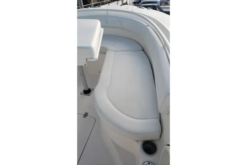  Yacht Photos Pics 2015 Edgewater 320CC boat interior with white cushioned seating.