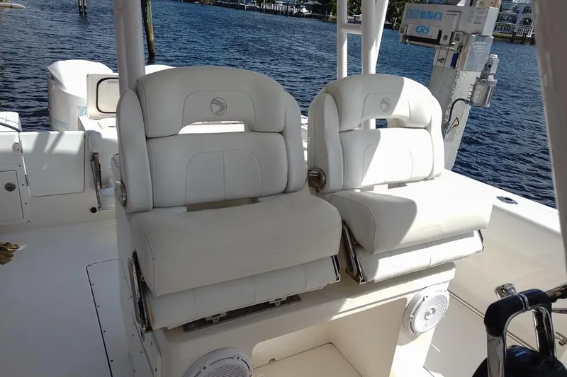  Yacht Photos Pics Luxurious seating on a 2015 Edgewater 320CC boat with waterfront view.