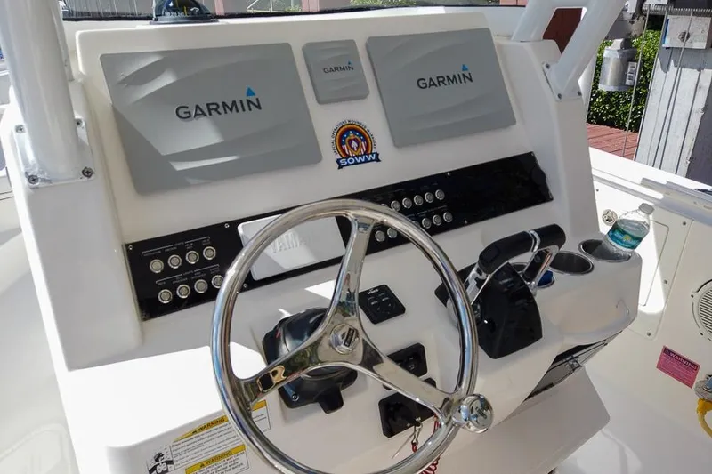  Yacht Photos Pics Edgewater 320CC 2015 boat dashboard with Garmin displays and steering wheel.
