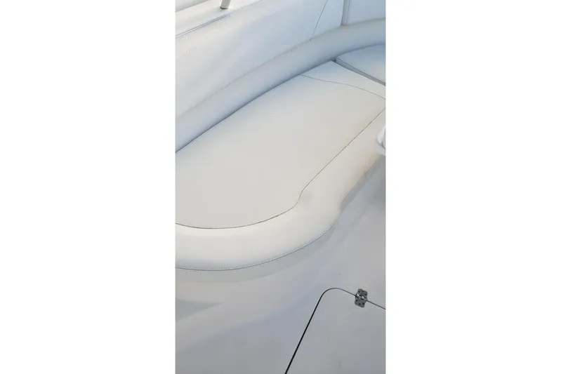  Yacht Photos Pics Edgewater 320CC 2015 boat interior with white cushioned seating.