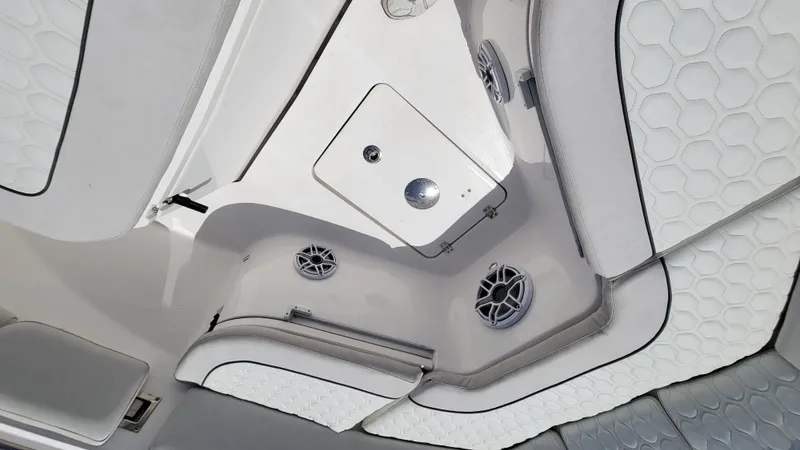  Yacht Photos Pics 2024 Sea Fox 288 Commander interior with white cushioned seating and built-in speakers.