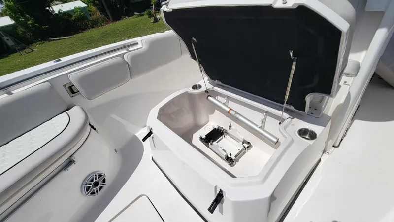  Yacht Photos Pics 2024 Sea Fox 288 Commander boat storage compartment with open hatch and seating area.