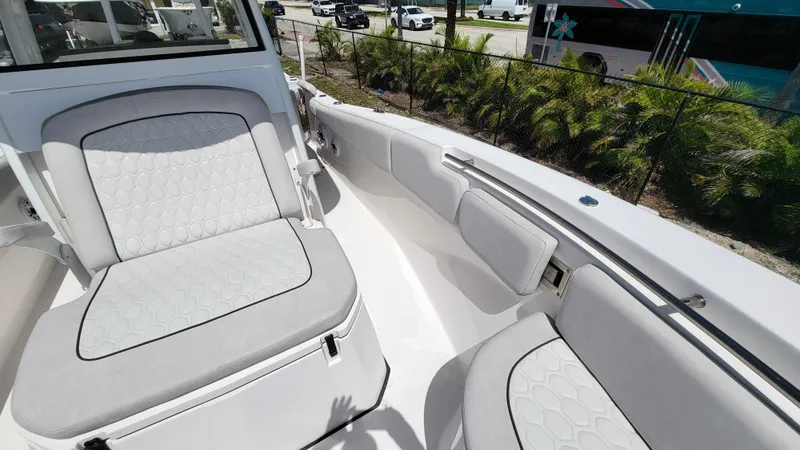  Yacht Photos Pics 2024 Sea Fox 288 Commander boat interior with cushioned seating and modern design.