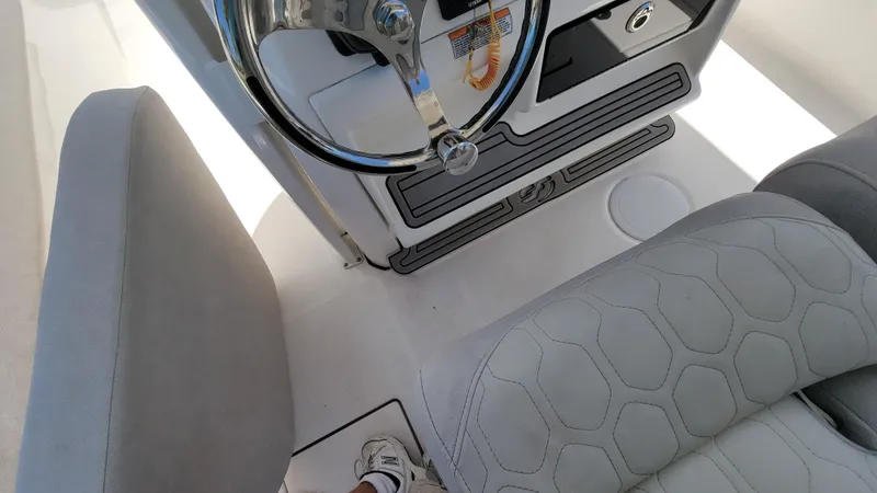  Yacht Photos Pics 2024 Sea Fox 288 Commander boat interior with steering wheel and seating.