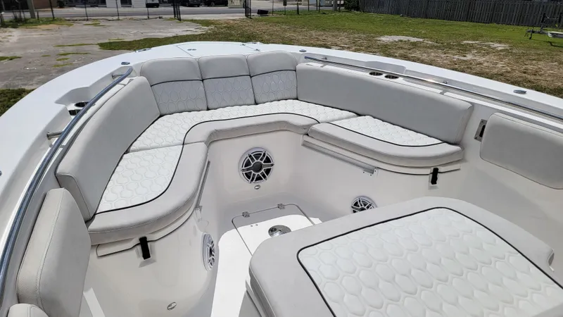  Yacht Photos Pics 2024 Sea Fox 288 Commander boat interior with cushioned seating and speakers.