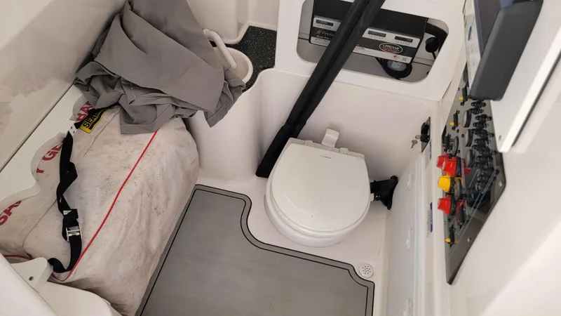  Yacht Photos Pics 2024 Sea Fox 288 Commander interior with toilet and storage area.