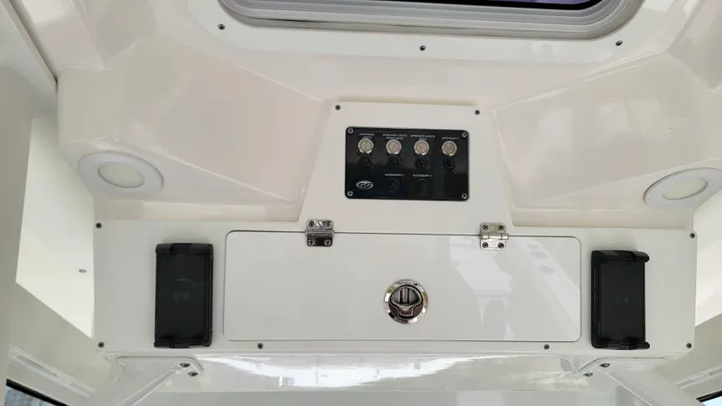  Yacht Photos Pics 2024 Sea Fox 288 Commander control panel with switches and storage compartment.