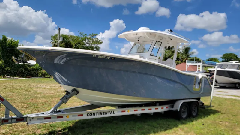  Yacht Photos Pics 2024 Sea Fox 288 Commander boat on trailer under blue sky.