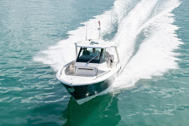  Yacht Photos Pics Manufacturer Provided Image: 2022 Tiara Yachts 34 LS cruising on clear blue water.