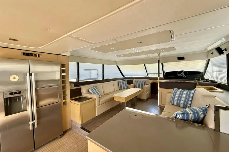  Yacht Photos Pics Luxurious interior of 2020 Fountaine Pajot MY 44 yacht with modern kitchen and seating area.