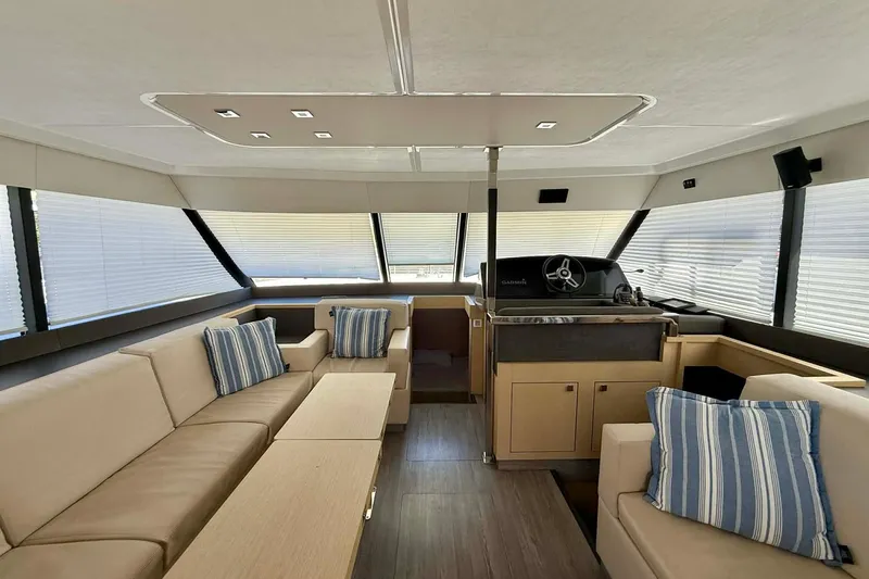  Yacht Photos Pics Luxurious interior of 2020 Fountaine Pajot MY 44 yacht with modern seating and helm.
