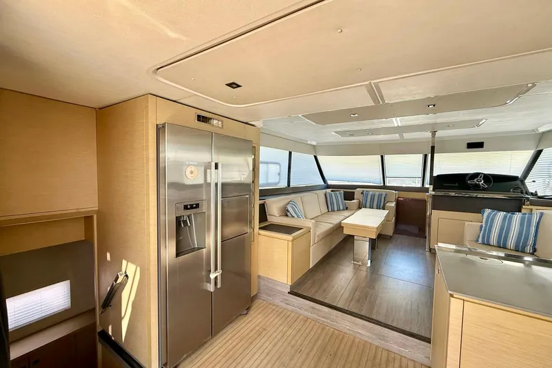 Yacht Photos Pics Luxurious interior of 2020 Fountaine Pajot MY 44 yacht with modern furnishings and large windows.