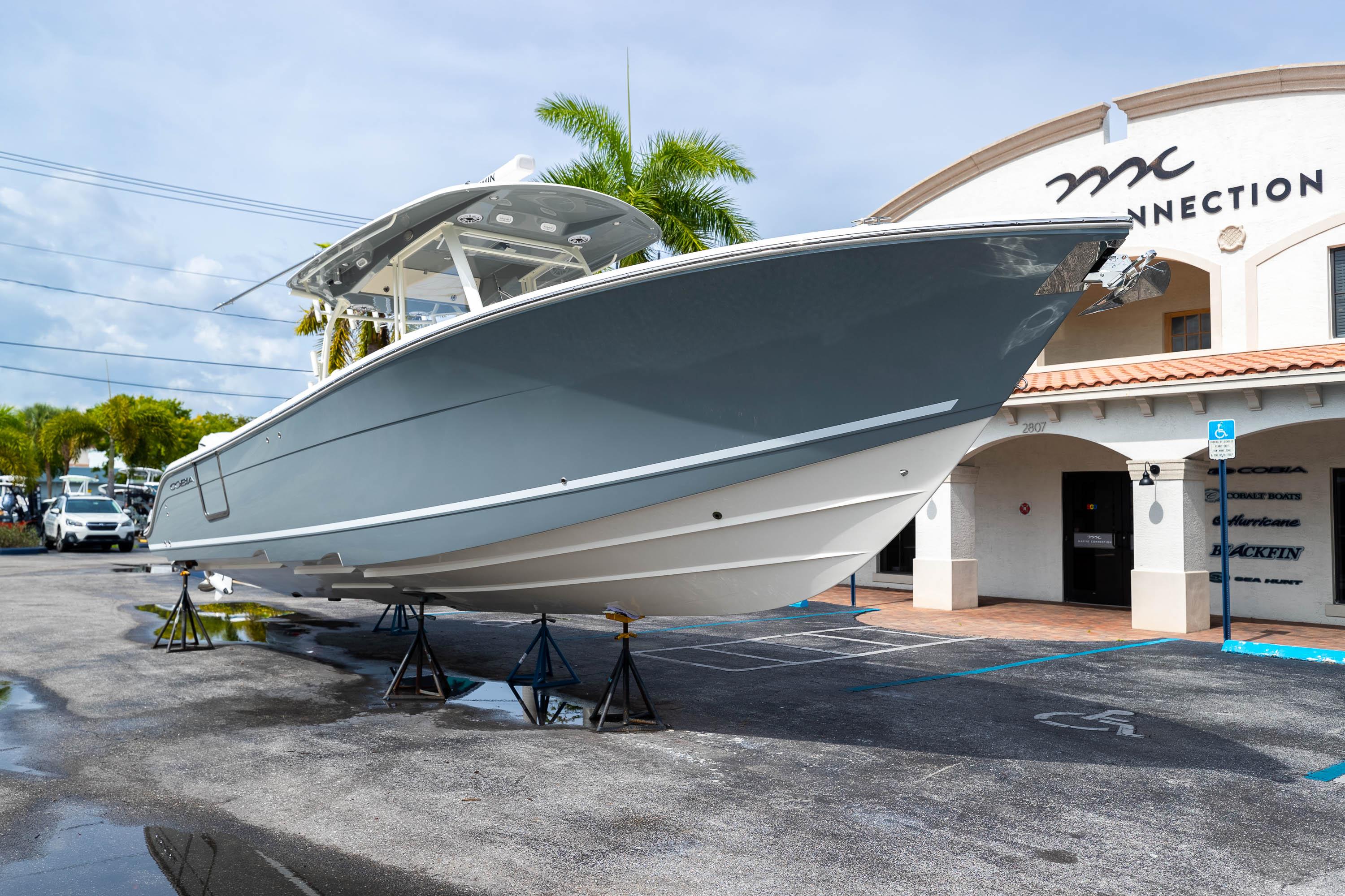 2023 Cobia 350 Center Console boat displayed outside a dealership.