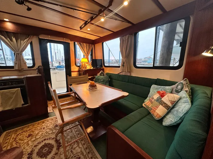 Ms. Moneypenny Yacht Photos Pics Interior of 2001 Nordic Tug 37 with cozy seating and nautical decor.