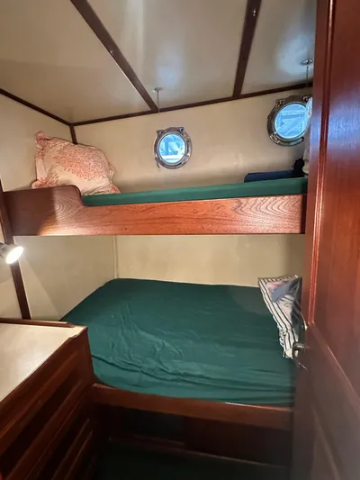Ms. Moneypenny Yacht Photos Pics Cozy cabin with bunk beds in a 2001 Nordic Tug 37 boat.