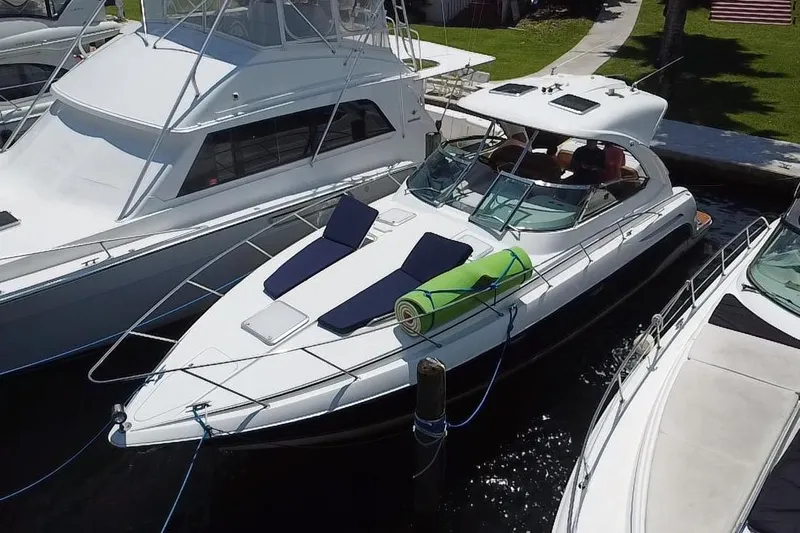  Yacht Photos Pics 2009 Formula 37 Performance Cruiser docked with sun loungers and green mat on deck.