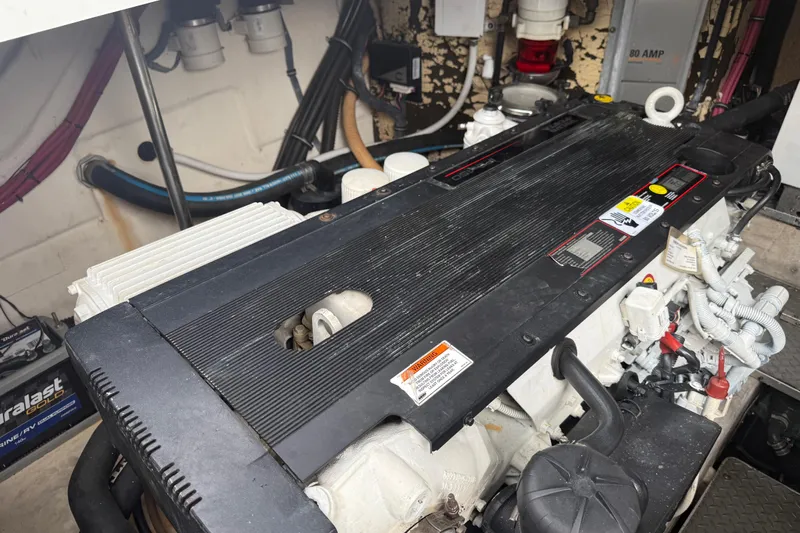  Yacht Photos Pics Engine compartment of a 2009 Formula 40 Performance Cruiser, showcasing detailed components and wiring.