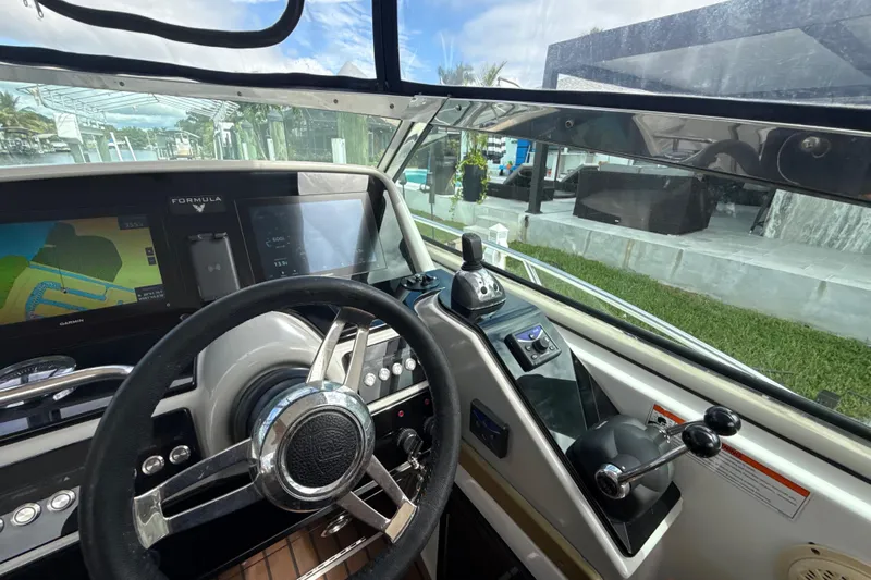  Yacht Photos Pics Cockpit view of 2009 Formula 40 Performance Cruiser with navigation screens and steering wheel.