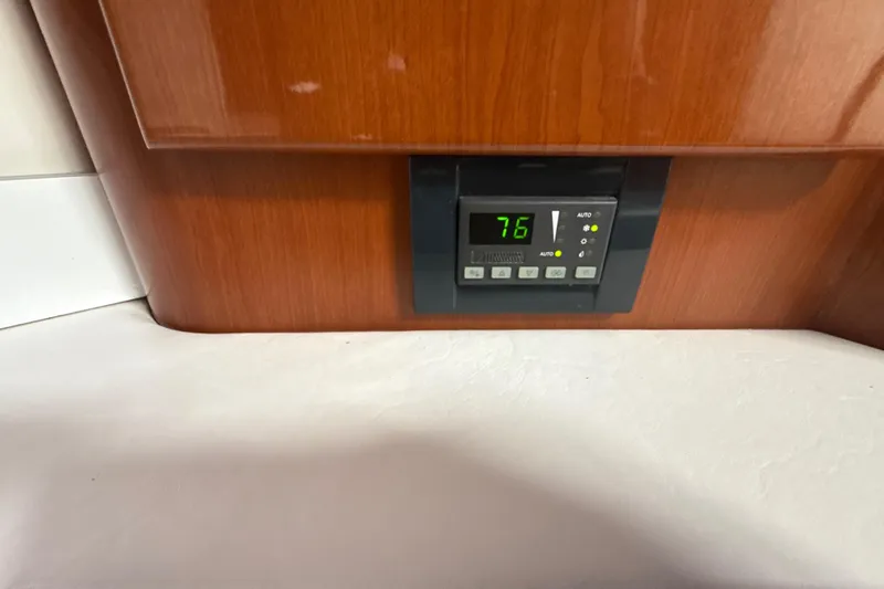  Yacht Photos Pics Digital control panel on 2009 Formula 40 Performance Cruiser, displaying temperature at 76 degrees.