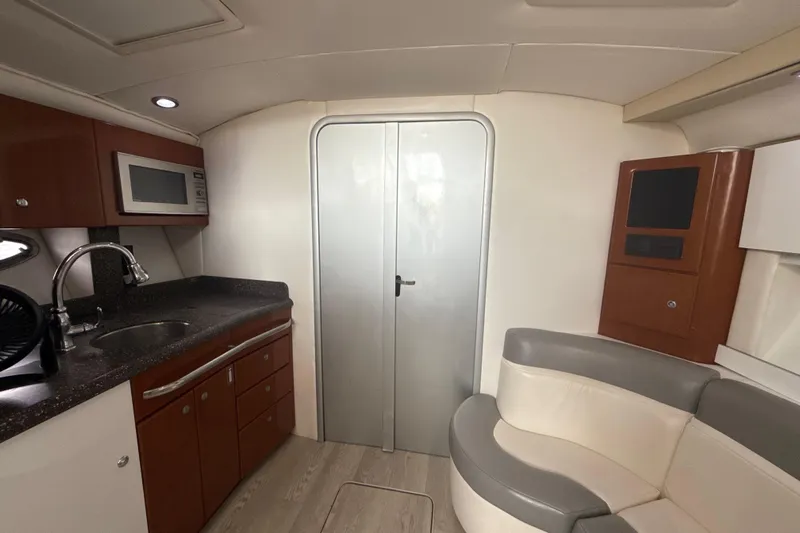  Yacht Photos Pics Interior of a 2009 Formula 40 Performance Cruiser with kitchenette and seating area.