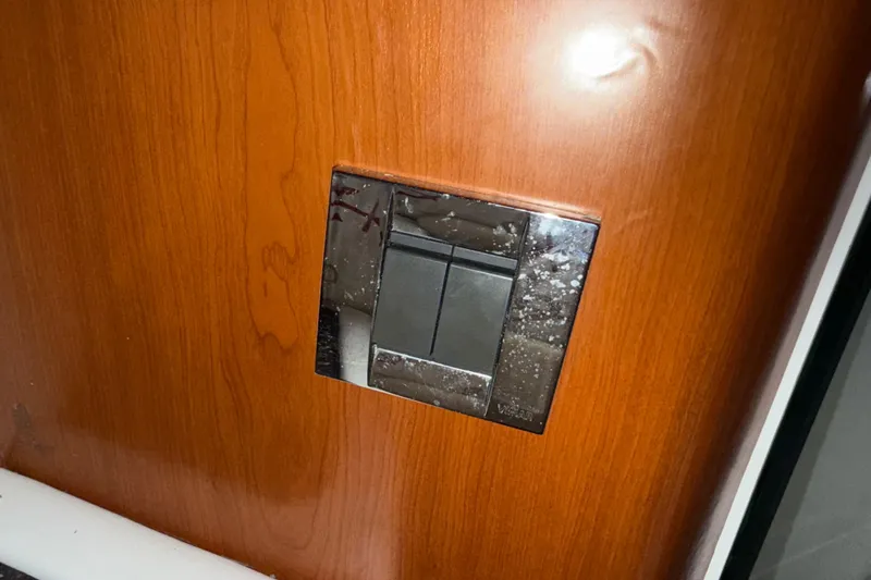 Yacht Photos Pics Light switch on wooden panel, 2009 Formula 40 Performance Cruiser interior.