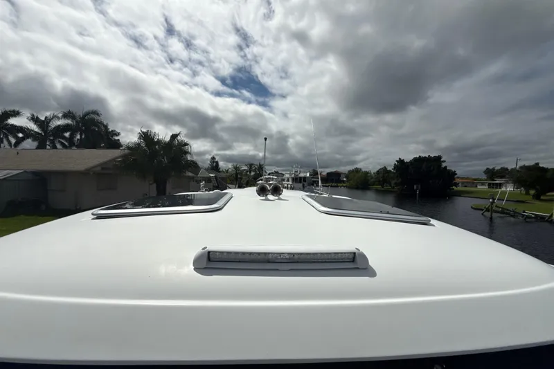  Yacht Photos Pics 2009 Formula 40 Performance Cruiser on a canal under cloudy skies.